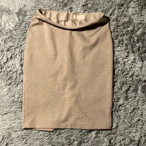 Light brown size 6 philosophy skirt with small slit in the back.